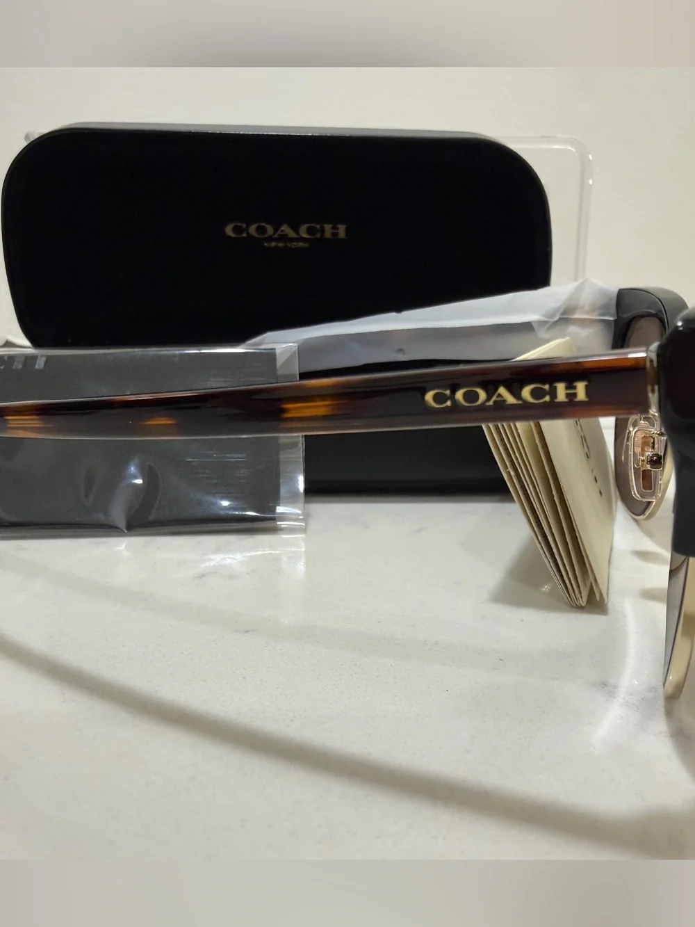 Coach Black Frame Sunglasses with Gold Trim and Brown Lenses